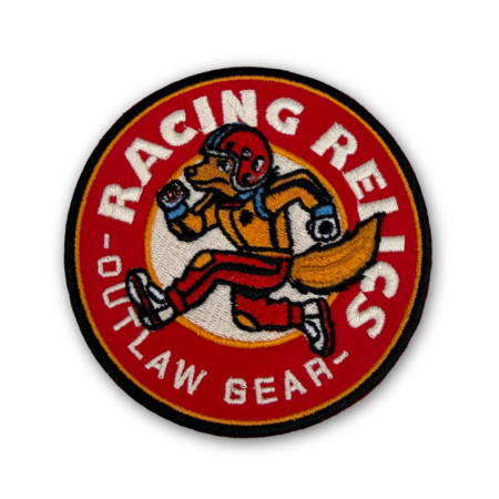 Embroidered Racing Relics “Outlaw Fox” patch featuring a racing fox mascot in red and gold.