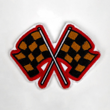 Embroidered Racing Relics “Finish Line” patch featuring crossed checkered flags in gold, black, and red.